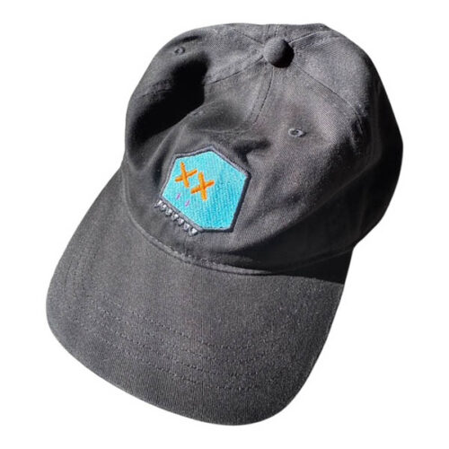 Black dad hat with turquoise patch featuring BXHD embroidery - black outline, ice head, oj eyes, white teeth, and purple nostrils.