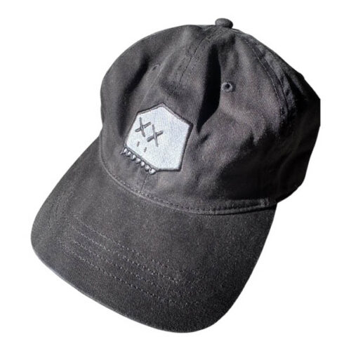 Black dad hat hat with embroidered white Boxhead design featuring stitched black outline, white head, black eyes, white teeth, and black nostrils