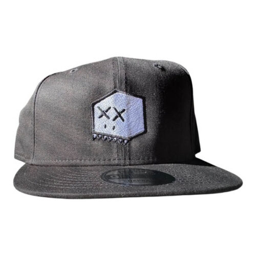 Black snapback hat with embroidered white Boxhead design featuring stitched black outline, white head, black eyes, white teeth, and black nostrils